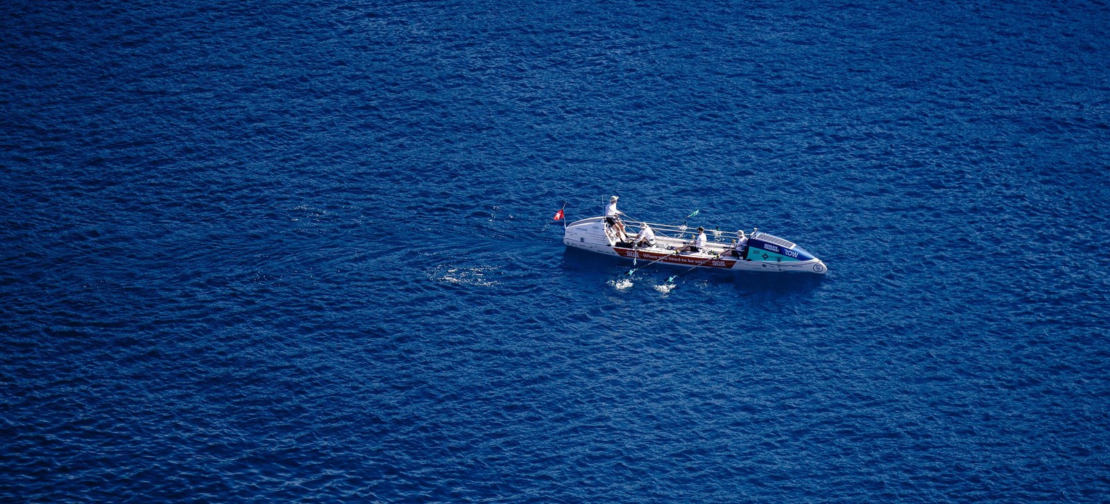 A single ocean rowing boat alone on the open Atlantic, seen from high above